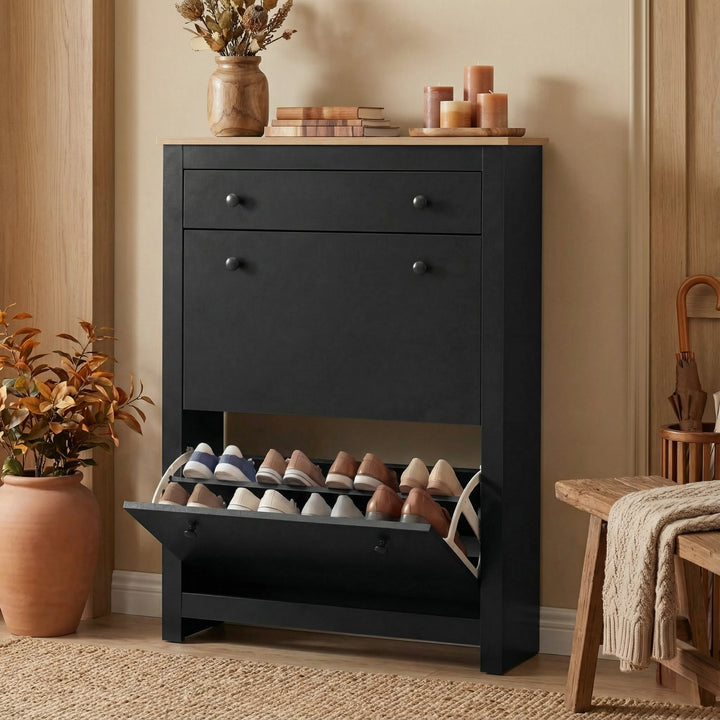 [Black] Hallway shoe storage unit with bottom flip-down door open showing pale shoes on angled rack