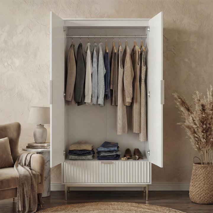 [White] flutrina white 2 door wardrobe shown open with garments on the hanging rail and lower drawer pulled out