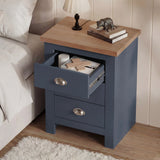[Blue] Top drawer of shaker nightstand open displaying candle and personal items inside