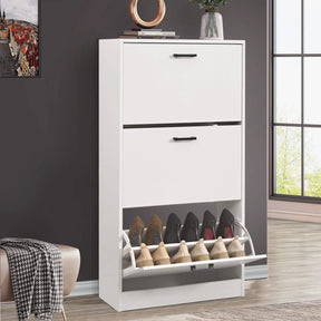 [White] White 3 drawer slim shoe cabinet in hallway with bottom flip drawer hinged open holding two rows of shoes