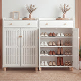 [White] Side-by-side white shoe storage cabinets demonstrating the closed-door look next to the open-shelf interior