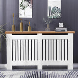 [Extra Large | White] Radiator cover with oak top and vertical slats, styled with gold decor and books, perfect for enhancing hallway aesthetics and warmth.