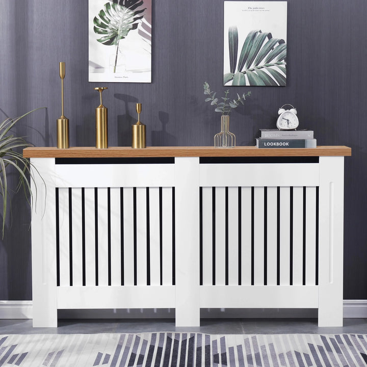 [Extra Large | White] Radiator cover with oak top and vertical slats, styled with gold decor and books, perfect for enhancing hallway aesthetics and warmth.