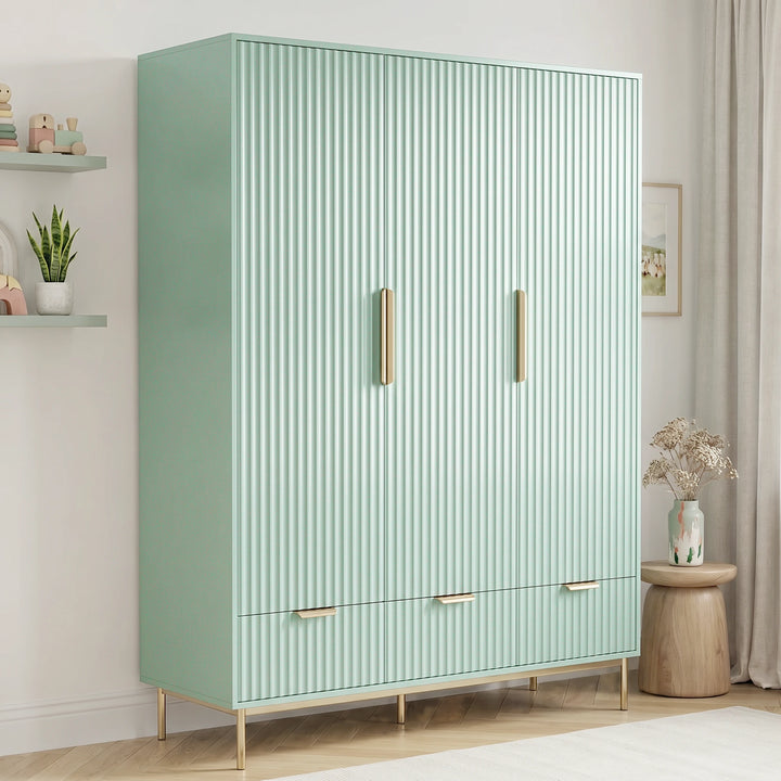 [Sage Green] three door wardrobe with integrated drawers placed in a contemporary room setting with natural lighting
