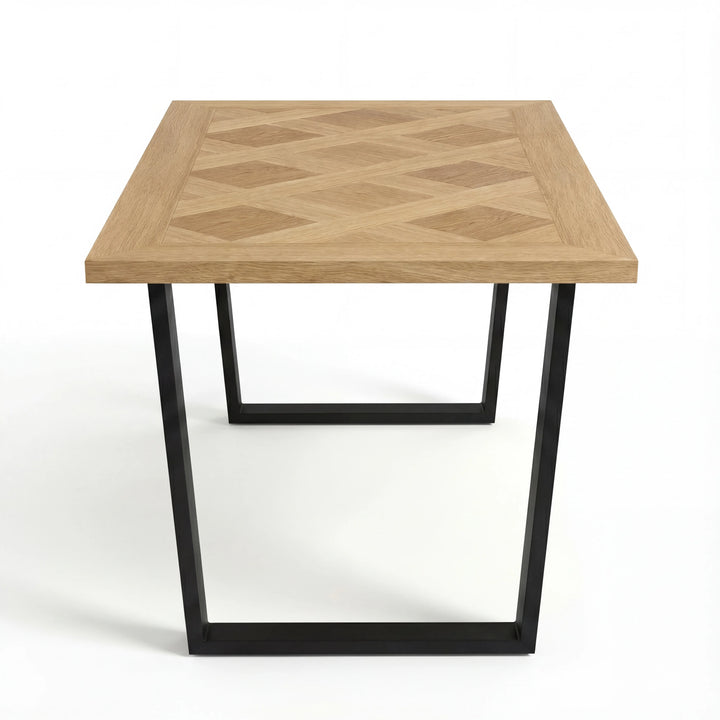 [6 Seater | Green] Aldridge dining table without chairs, corner view showing diamond parquet inlay and black base.
