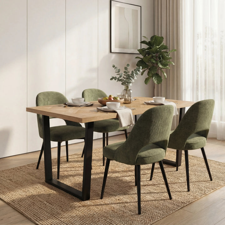[4 Seater | Green] 4 green curved-back dining chairs flank the Aldridge oak table on jute rug with plant on console.