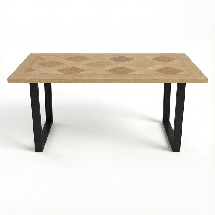 [6 Seater | Grey] Aldridge rectangular dining table with oak parquet top and matt black sled legs, straight on view.