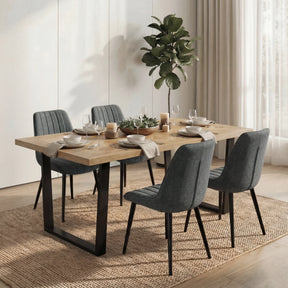 [4 Seater | Grey] Aldridge dining table seats 4 grey ribbed chairs on jute rug with table set for dinner.