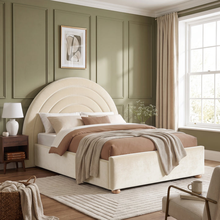 [Beige | Double] Wide bedroom view of beige rainbow ottoman bed with curved headboard, rug, side tables and window