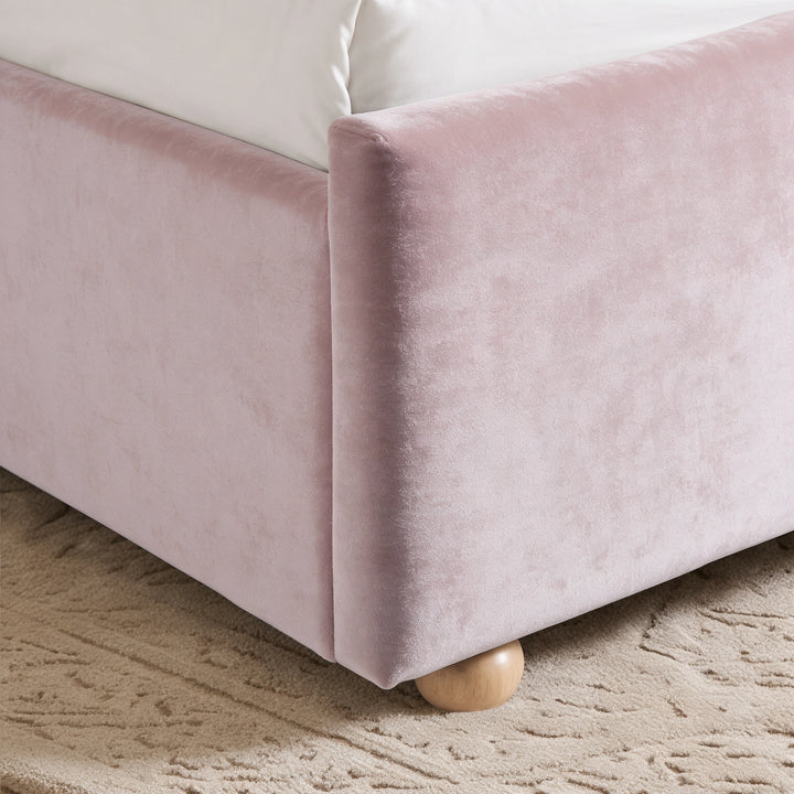 [Pink | Double] Close-up of pink plush velvet footboard corner, raised side rail and low round wooden foot