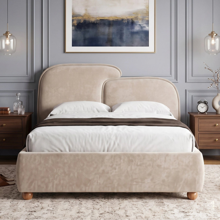 [King | Beige] upholstered bed with a double-headed curved headboard and matching footboard, styled in a bedroom with gray paneled walls, wooden nightstands, and a framed abstract painting above.