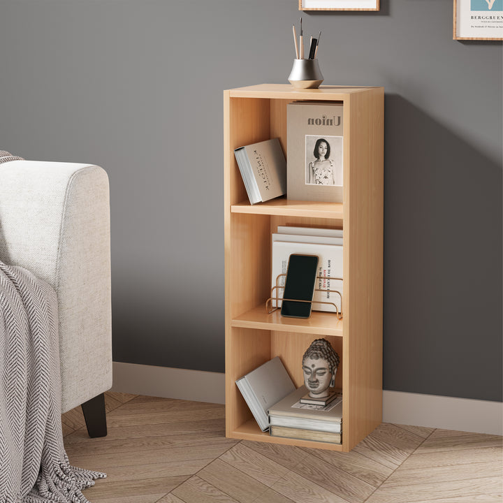 [3 Shelf | Beech] three-quarter shot of three-cubby half-height beech cube bookcase with linen-shade table lamp