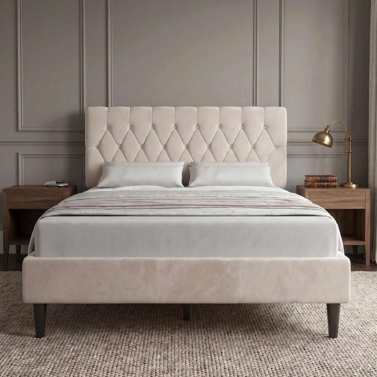 [Double | Beige] Velvet Chesterfield bed in a styled bedroom with dark panelled wall and bedside lamps