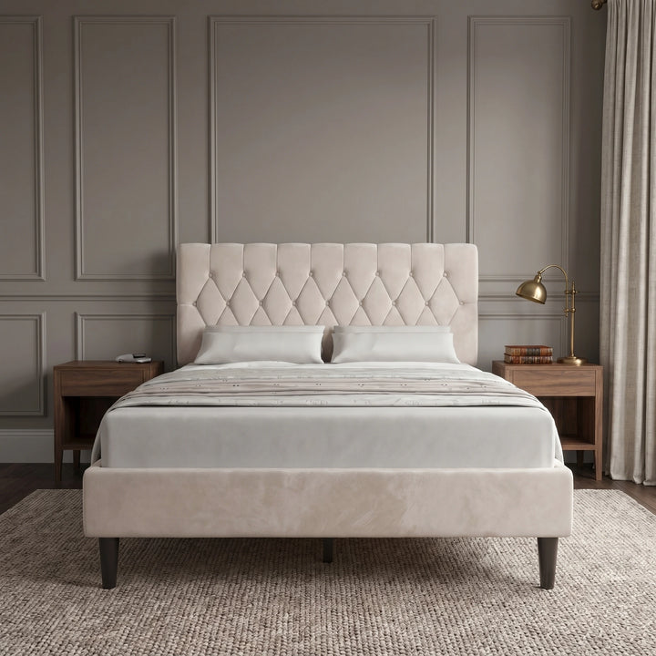 [King | Beige] Velvet Chesterfield bed in a styled bedroom with dark panelled wall and bedside lamps
