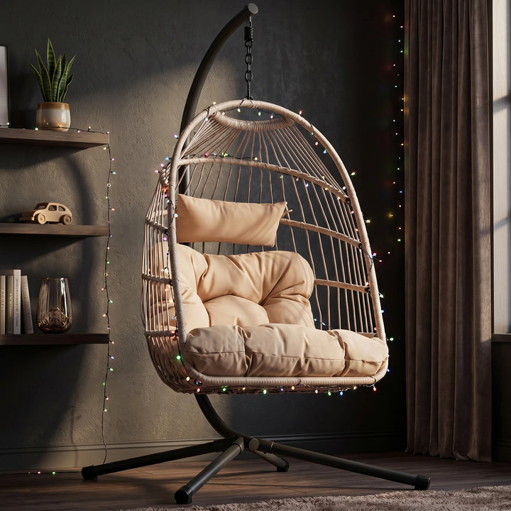 [Beige] hanging egg chair with plush cushions and stand, styled with ambient lights for indoor relaxation