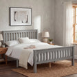 [Grey] wooden double bed frame grey, flanked by oak bedsides, art above and small plant on right