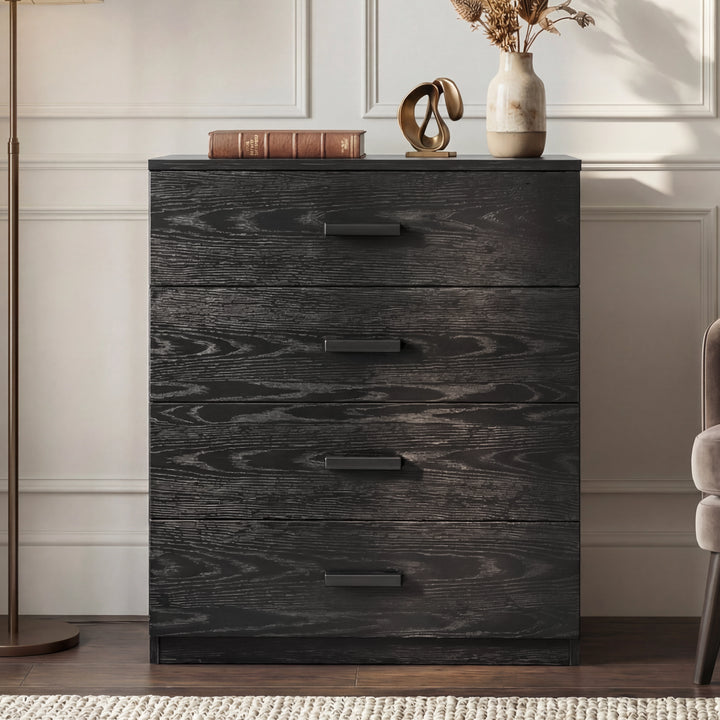 [Black] Front view of black four drawer chest with flat drawer fronts and integrated handle detail