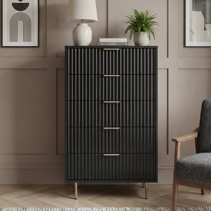[Black] bedroom chest front elevation highlighting five drawers in flutrina structured, and elevated metal legs