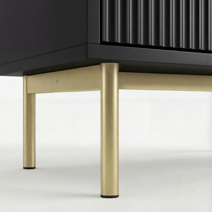 [Black] Lower frame of black 5 chest of drawers showing gold metal legs and base corner construction