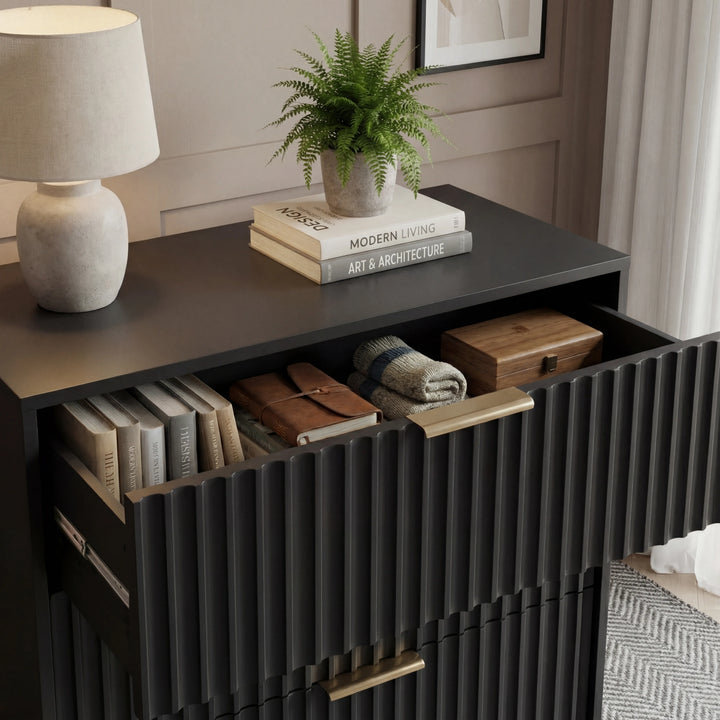 [Black] Flutrina 5 drawer chest top detail, open top drawer reveals linens, lamp and fern above