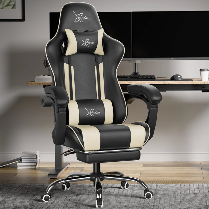[Black + White] Black and white gaming chair in a modern office setup with a desk and computer monitors.