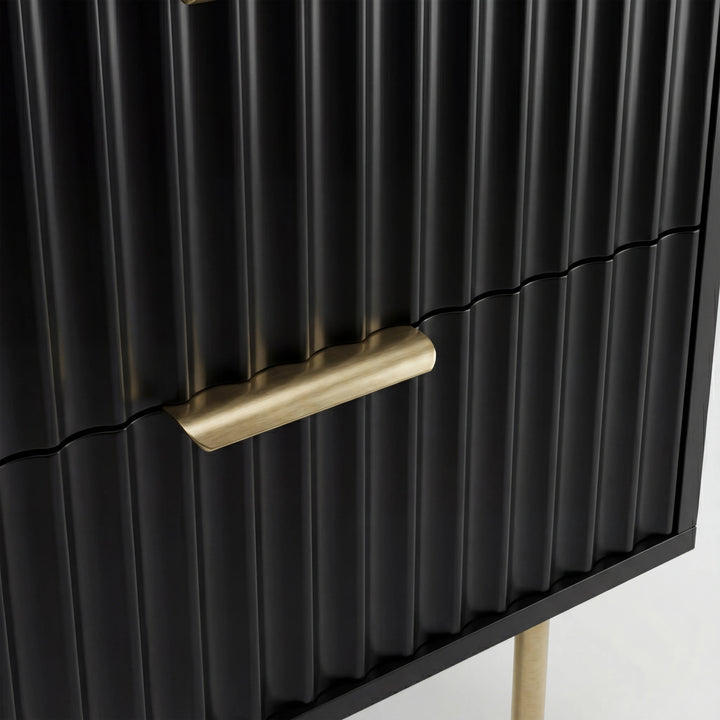 [Black] Close detail of the gold metal drawer handle and legs of the black flutrina design bedside table