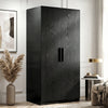 [Black] Blythe wardrobe angled view showing textured wood grain doors and matte black bar handles in a styled bedroom
