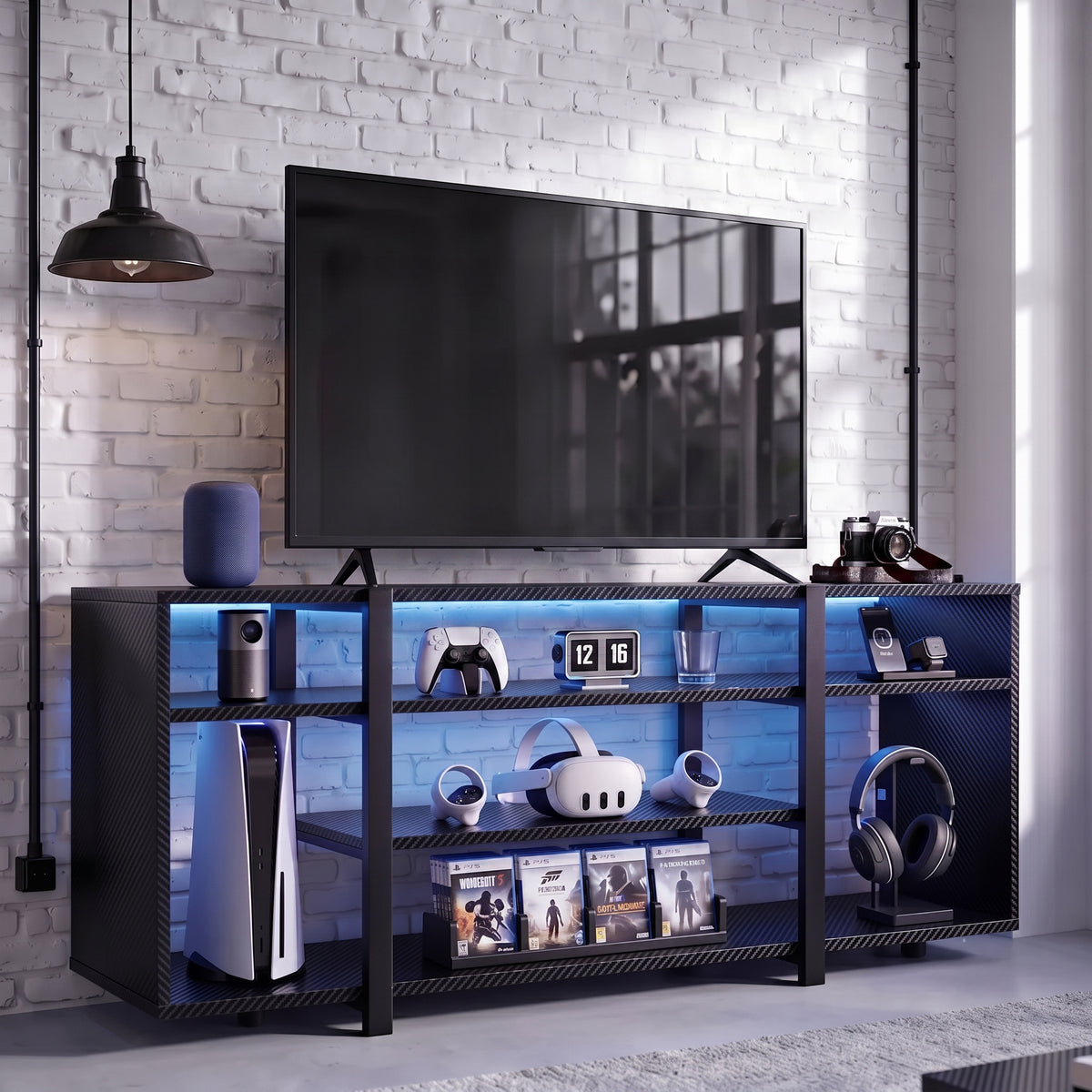 [Black Carbon Fibre] LED TV Stand with Storage styled in a gaming room with blue LED shelf lighting, open shelves holding a console, VR headset and game cases
