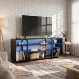 [Black Carbon Fibre] LED TV Stand with Storage in a bright living room with blue LED underlighting, open shelves holding books, a basket, photo frame and vinyl records