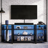 [Black Carbon Fibre] Zelumi TV stand in a brick-wall room with blue LED shelves holding consoles, VR headset, game cases, and headphones on stand