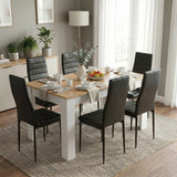 [6 Seater | Black] White & Pine 4-6 Seater Dining Table and Chairs Set showcasing the dining table completely dressed with matching bowls, plates, and a decorative vase