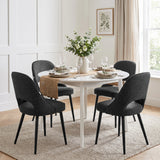 [Black | Set of 4] Four comfy dining room chairs arranged around a round white table styled with tableware and a flower vase.