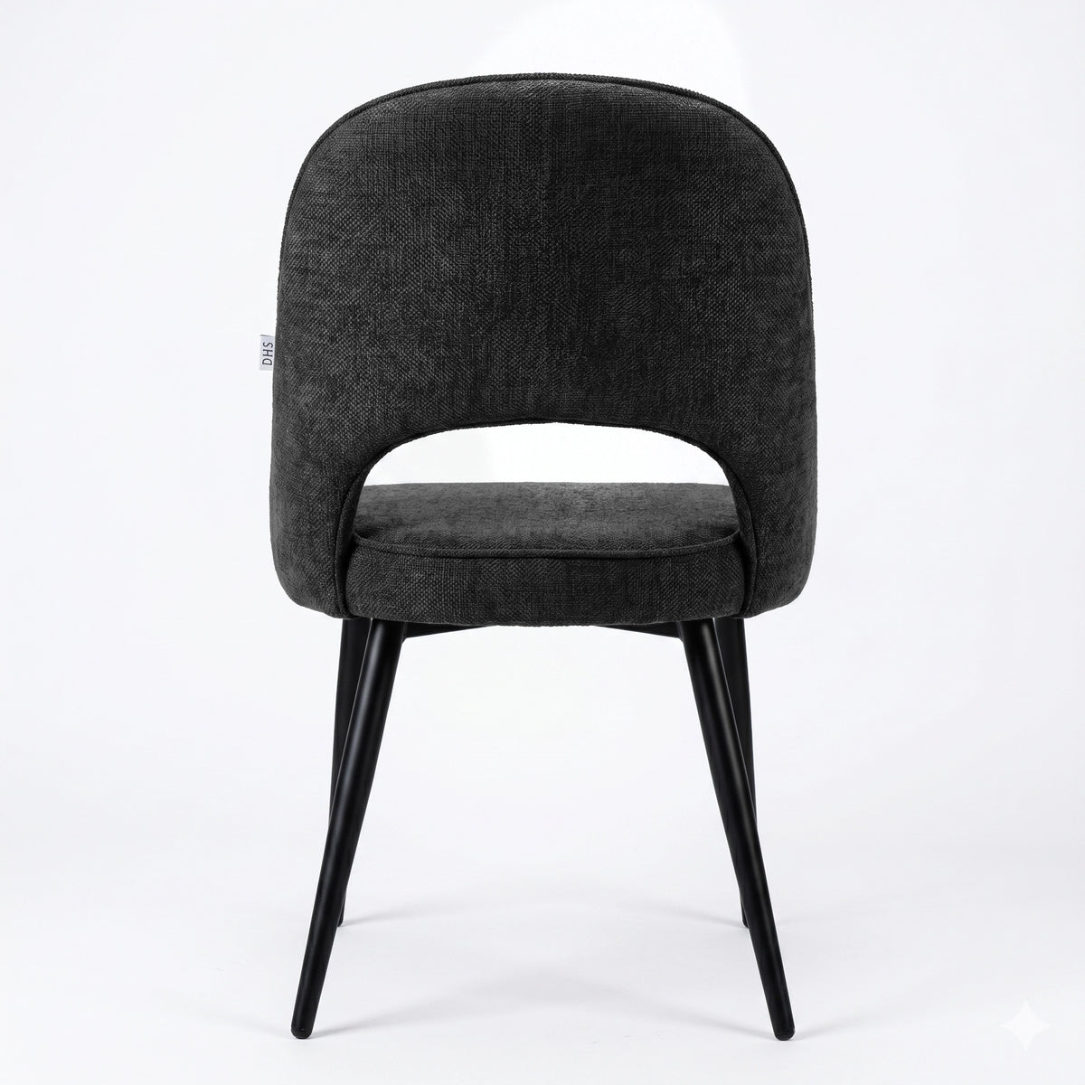[Black | Set of 4] Rear view of the comfy fabric dining chair with rounded open back, piped seat and four black metal legs.