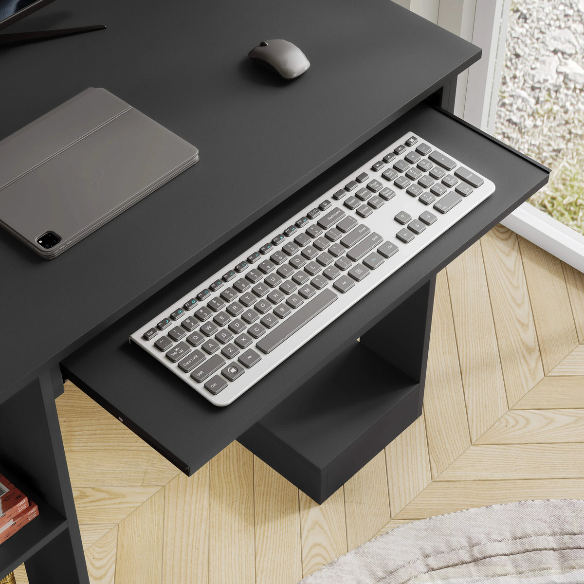 [Black] Black home office desk detail showing extended keyboard tray and base shelf below the work surface