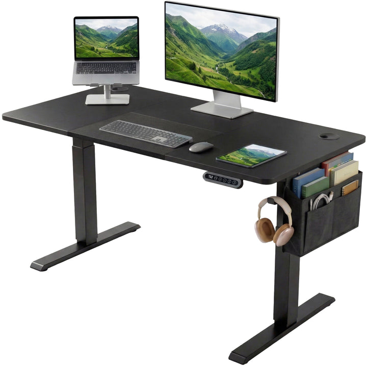 [120cm x 60cm] Electric Standing Desk Height Adjustable showing a dual-device workspace on a black surface featuring an elevated laptop, primary monitor screen, a tablet, and a side storage pouch