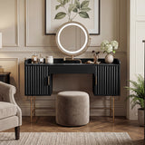 [Black] front view of the black flutrina makeup desk with framed botanical print above the round mirror and a stool