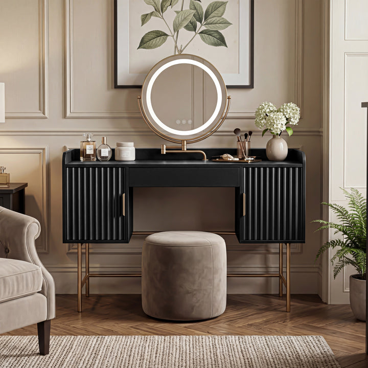 [Black] front view of the black flutrina makeup desk with framed botanical print above the round mirror and a stool
