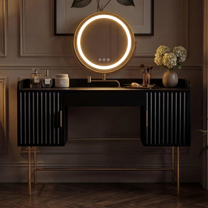 [Black] front view of the black fluted dressing desk with two side cabinets and a centred glowing round LED mirror