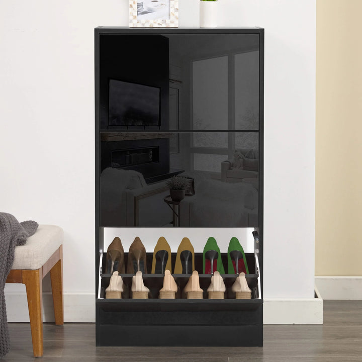 [Black] Slim shoe cabinet for hallway with its bottom drawer open in a front view, holding multiple pairs of shoes.