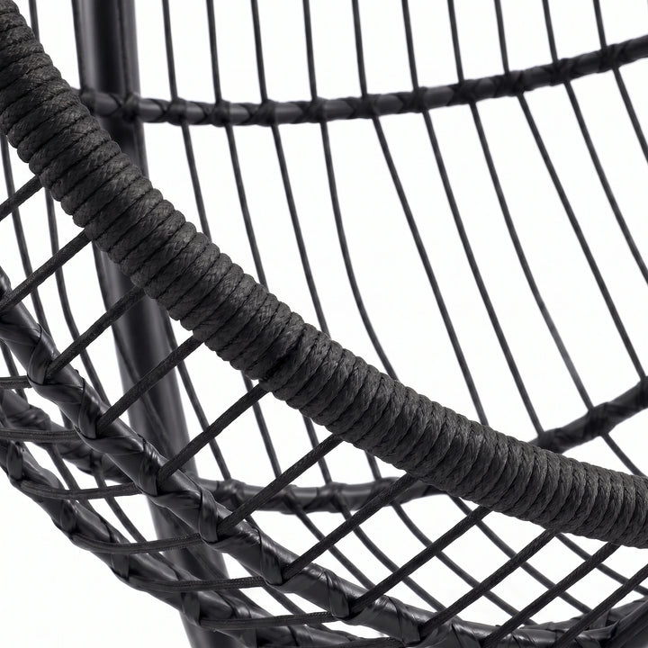 [Black] Close-up of a black woven chair with a rope seat on a white background