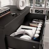 [Black] Close-up of drawer in black high gloss chest, showing storage for headphones, notebooks, and daily essentials.