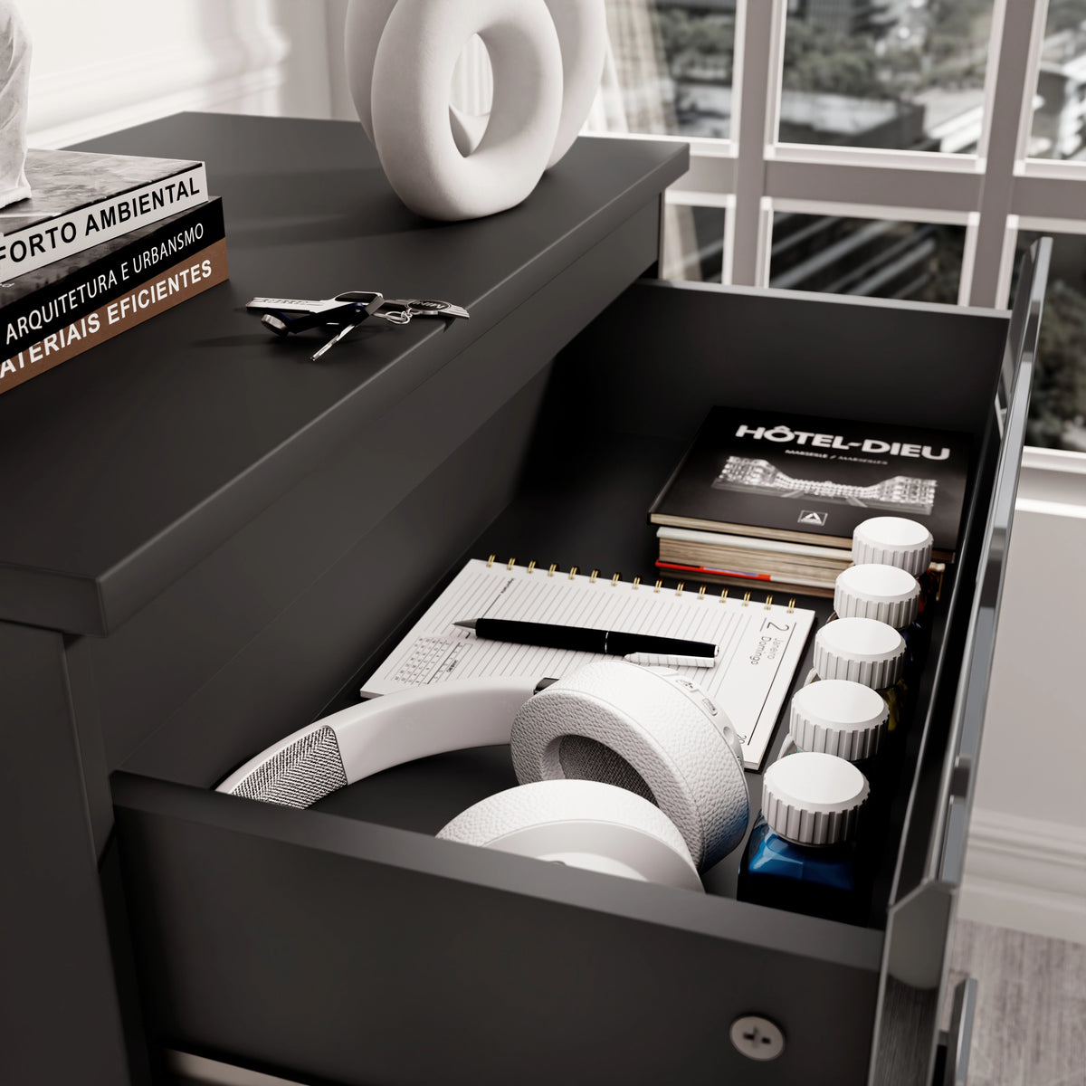 [Black] Close-up of drawer in black high gloss chest, showing storage for headphones, notebooks, and daily essentials.