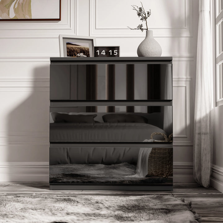 [Black] front view of black 3 drawer chest from the high gloss bedroom range, mirror-finish drawers on white painted floor