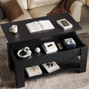 [Black] Lift top coffee table in black finish with open book on surface next to cream sofa.