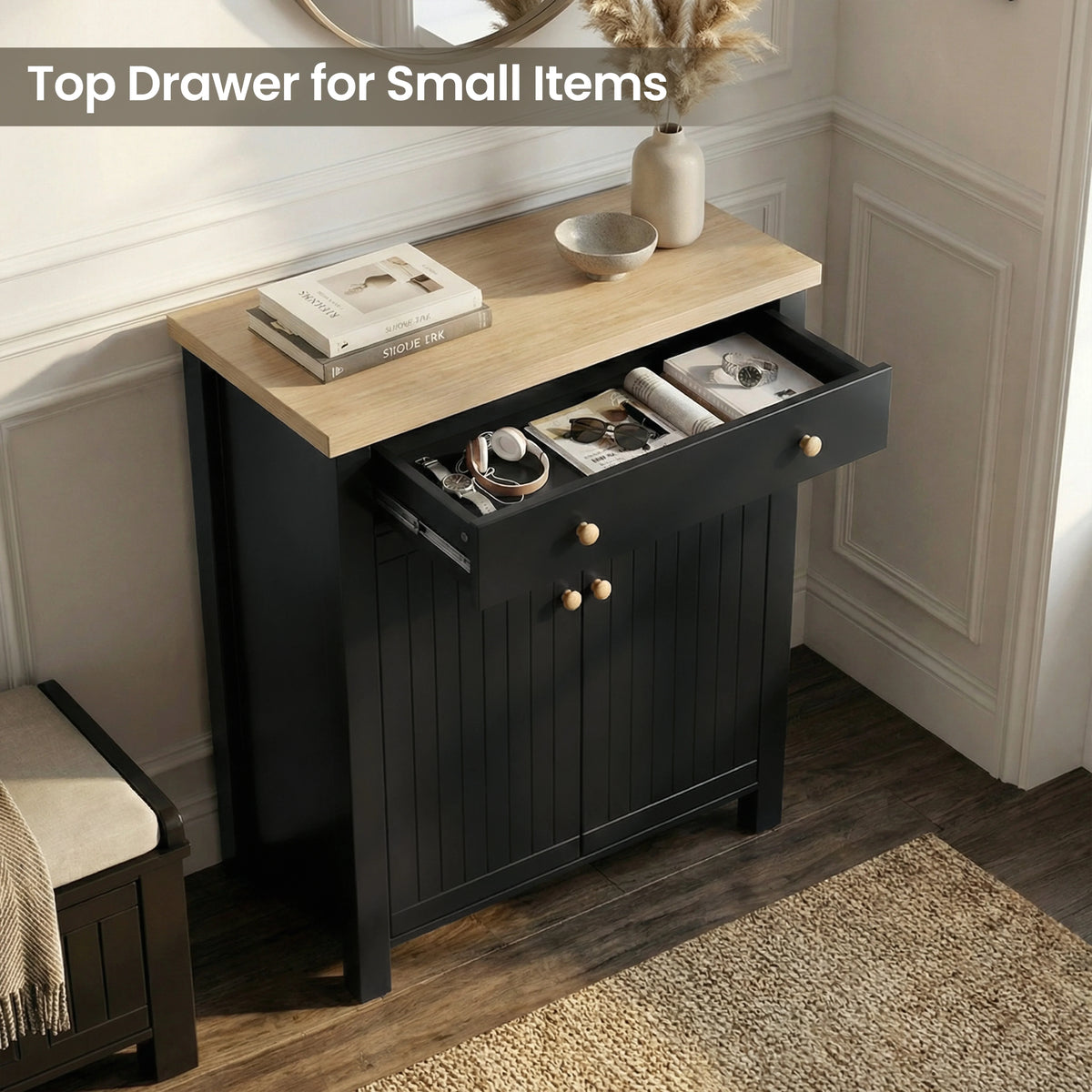 [Black] Linra shoe cabinet with top drawer pulled open holding headphones, sunglasses, and watch in a dark hallway setting