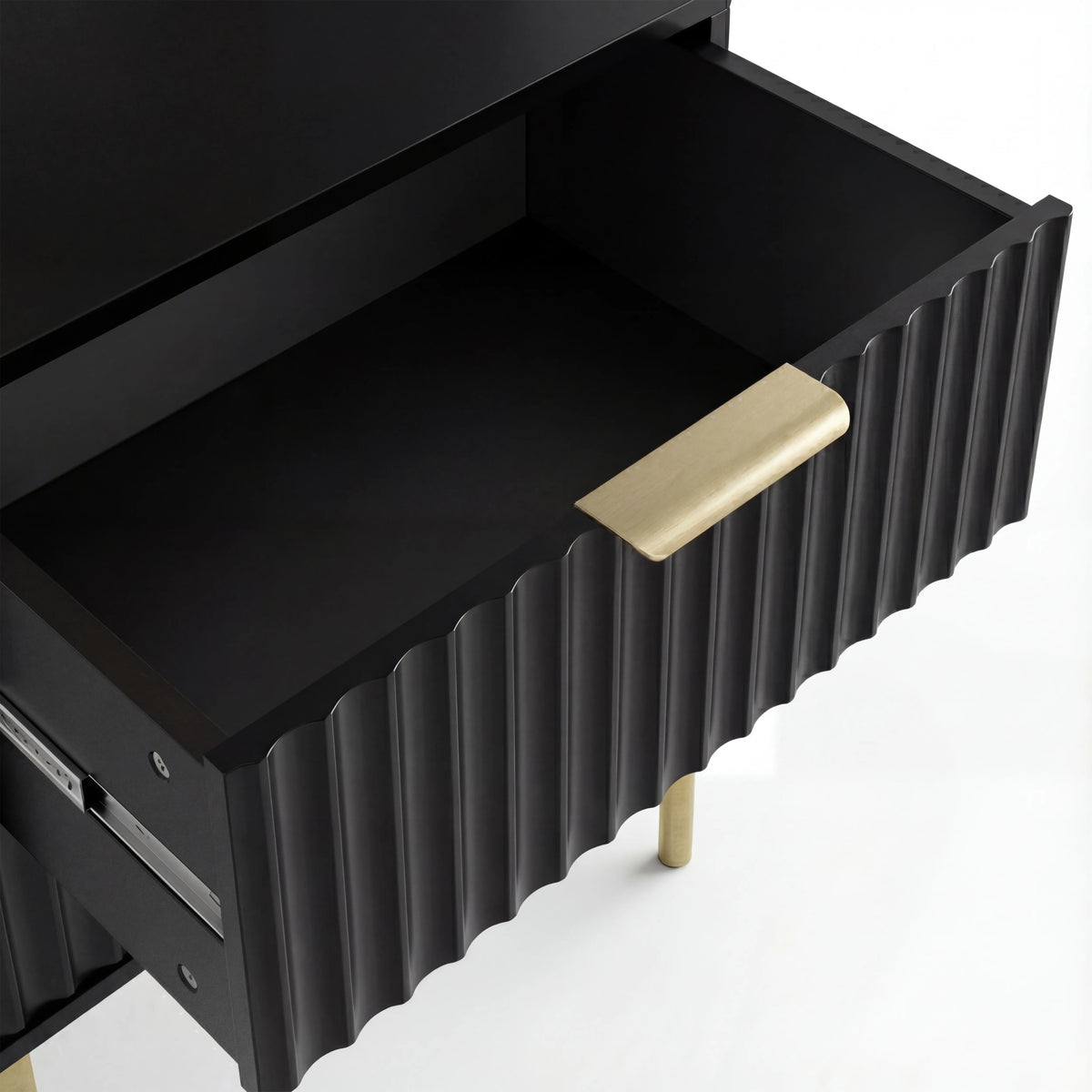 [Black] Open black flutrina bedside drawer revealing flat painted base with brushed gold bar handle on fluted front
