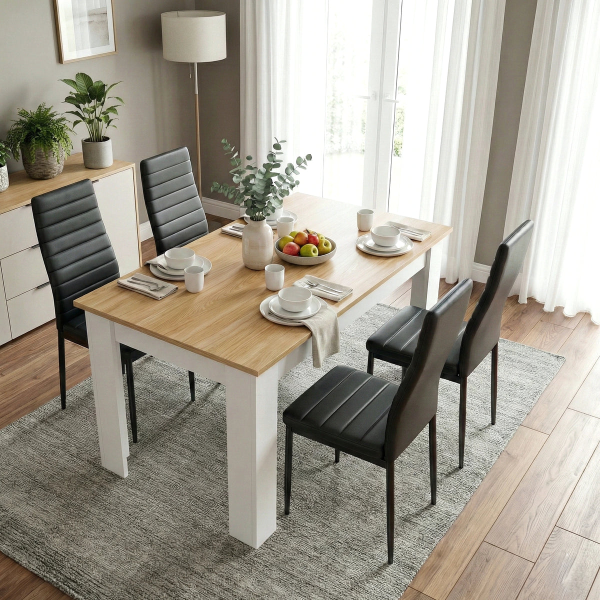 [4 Seater | Black] Dining Table and Chairs Set viewed from above in a styled dining room with four black chairs, place settings, and a fruit bowl centrepiece