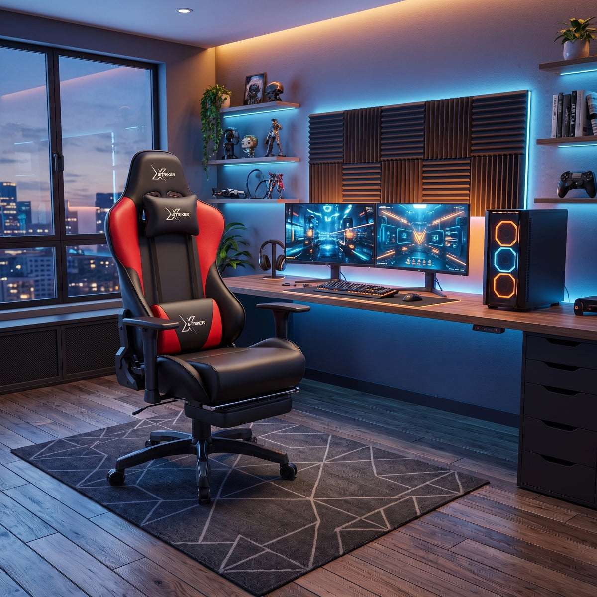 [Black + Red] gaming chair with a headrest pillow and footrest, placed in a modern home office setup with dual monitors, a desk, and ambient blue lighting.