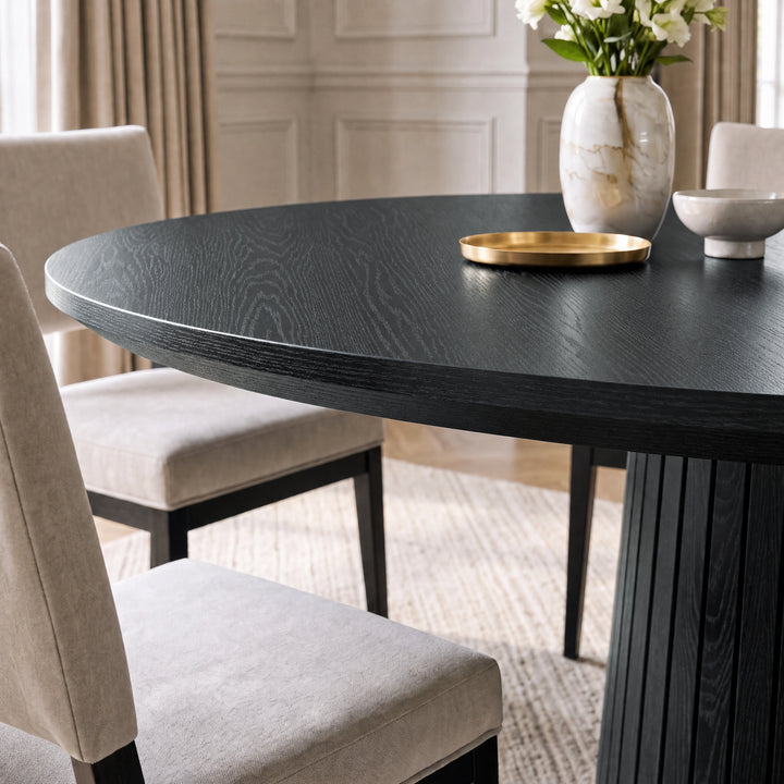 [Black] Close-up of round pedestal dining table top edge and wood grain