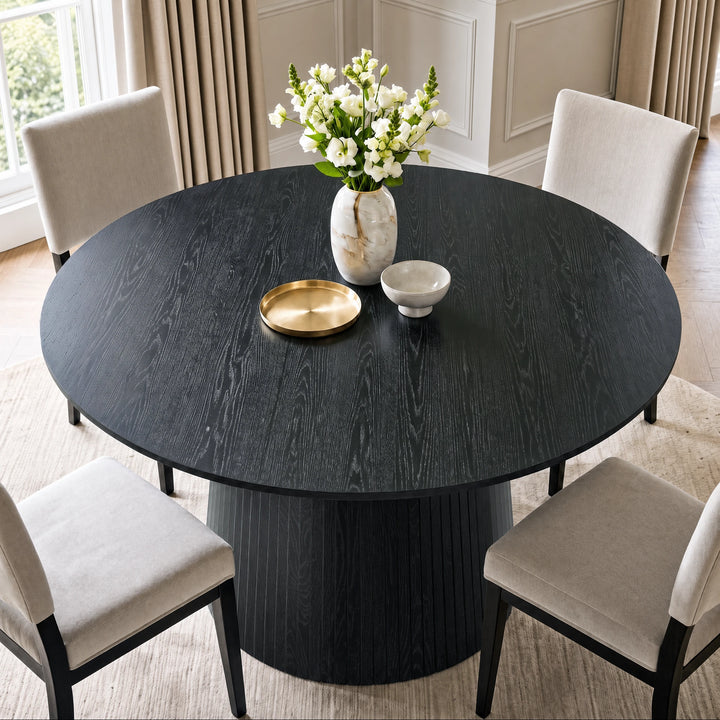 [Black] Close-up of round pedestal dining table top edge and wood grain